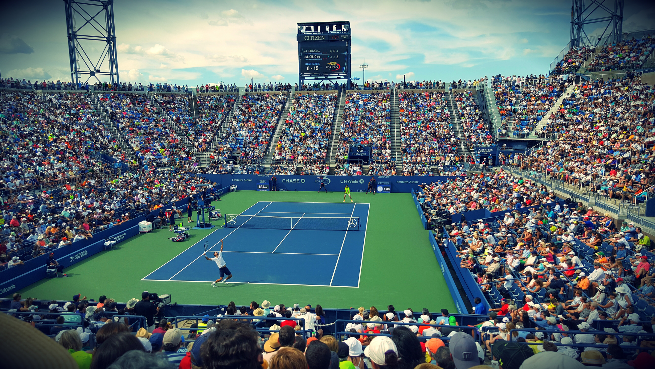 Tennis Match in a Stadium with Crowd